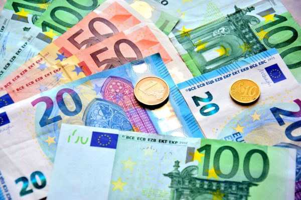 View of Euro coins and banknotes on the table.